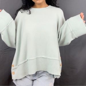 Light turquoise oversized sweater in size Large.